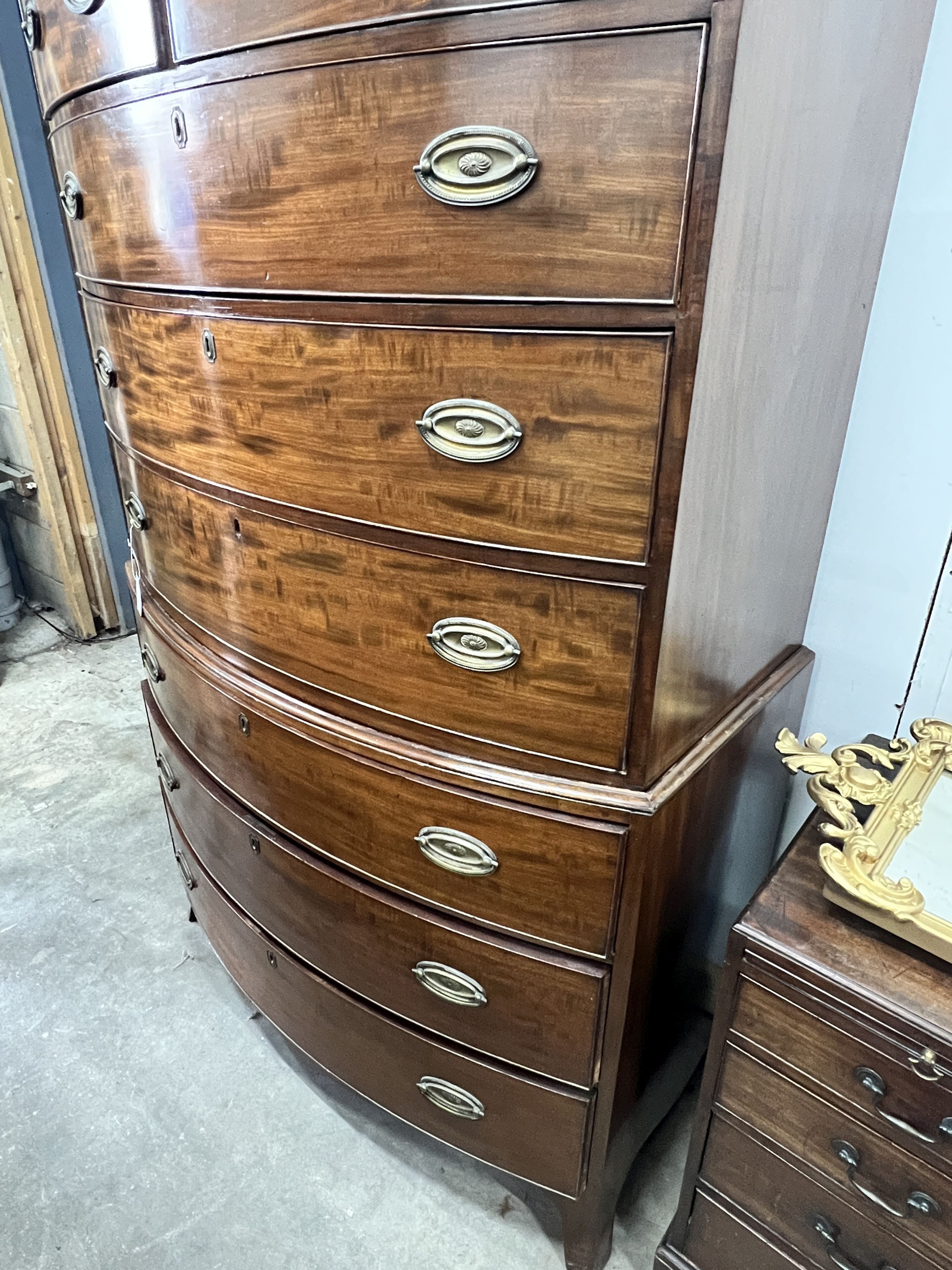 A George IV mahogany bow front chest on chest, width 116cm, depth 65cm, height 193cm